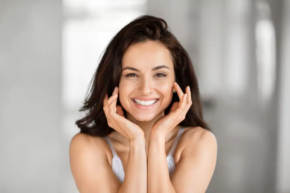 Woman after Zoom teeth whitening treatment at Linden Market Dental from a dentist
